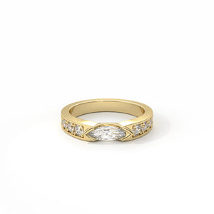 Gold ring with a central diamond and smaller diamonds on a white background