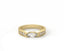 Gold ring with a central diamond and smaller diamonds on a white background