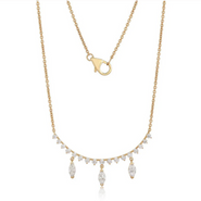 A gold and diamond necklace with a row of round diamonds with three marquise diamonds attached to the bottom of the curved row. 