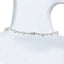 Pearl necklace on a mannequin with a white background
