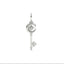 Silver key-shaped pendant with a moon and star design on a white background