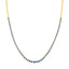 Gold necklace with blue beads on a white background
