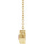 Gold necklace with a rectangular pendant on a white background