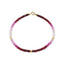A faceted gemstone ombre beaded bracelet with three gold accents and a round clasp. 