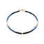 A faceted gemstone ombre beaded bracelet with three gold accents and a round clasp. 