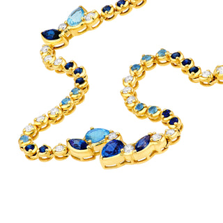 A blue sapphire necklace with pear shaped clusters.