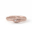 Rose gold ring with diamond on a white background