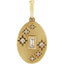 Gold pendant with star designs and a central gemstone on a white background