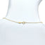 Gold chain bracelet on a mannequin with a white background