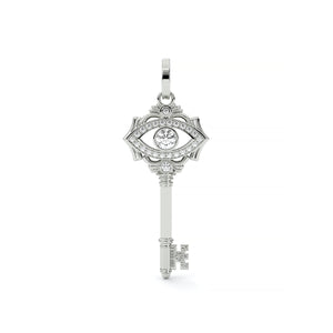 Silver key-shaped pendant with eye design on a white background