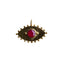 A gold eye pendant with a round colored gemstone bezel set on the center. With gold beaded detailed designs are the outer boarder. 
