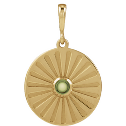 A round coin pendant with a round natural colored gemstone and a starburst ray design. 
