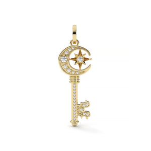 Gold key-shaped pendant with star and moon design on a white background