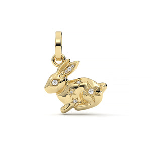 Gold rabbit-shaped pendant with diamond accents on a white background