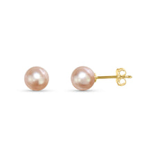 Two light pink pearl stud earrings