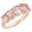 Rose gold ring with pink gemstones on a white background