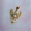 a pixie charm with diamond and wings and dangling stars