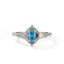 Silver ring with a blue gemstone on a white background