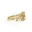 Gold ring with diamond accents on a white background