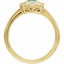 Gold ring with gemstone and diamonds on a white background