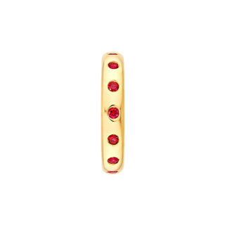 A ruby eternity ring made in yellow gold with round ruby. 