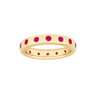A ruby eternity ring made in yellow gold with round ruby. 