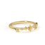 Gold ring with star-shaped diamonds on a white background