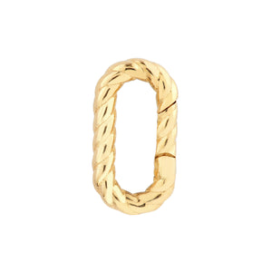 A solid gold oval carabiner snap connector. The connector has a twist design. 