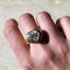 Solid gold heart signet ring with diamond on model