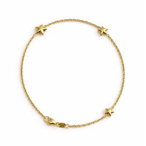 Gold bracelet with star charms on a white background