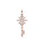 Rose gold snowflake key pendant on a white background