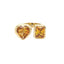 A toi et moi ring or two stone ring with one heart shaped citrine and the other emerald cut citrine. Both bezel set on a thick heavy band. 