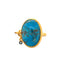 A large oval blue turquoise stone bezel set in gold vermeil. On the side it has a diamond shaker to add uniqueness to the design. Simple tube band. 