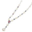Pearl necklace with pink heart-shaped gem and silver accents on a white background