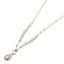 A gold paperclip chain with pearls and a pearl pendant drop.