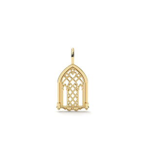 Gold pendant with intricate design on a white background