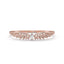 Rose gold ring with diamond accents on a white background