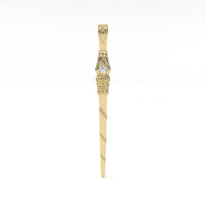 Decorative gold letter opener on a white background