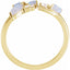Gold ring with opal and diamond stones on a white background