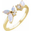 Gold ring with opal and diamond stones on a white background