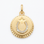 A gold round pendant charm featuring a stylized horseshoe design embellished with small clear stones and a star motif, set against a plain light background.