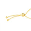 A dainty adjustable chain bracelet with a single bezel set gemstone close up