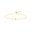 A dainty adjustable chain bracelet with a single bezel set gemstone