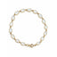 Gold bracelet with white stones on a white background