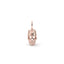 Rose gold skull pendant on a white background