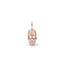 Rose gold skull pendant on a white background