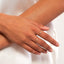 a bezel diamond ring on a model