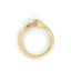 Gold ring with a hand design on a white background