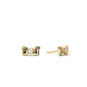 Gold bow-shaped earrings with clear gemstones on a white background