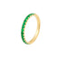 Gold ring with green gemstones on a white background